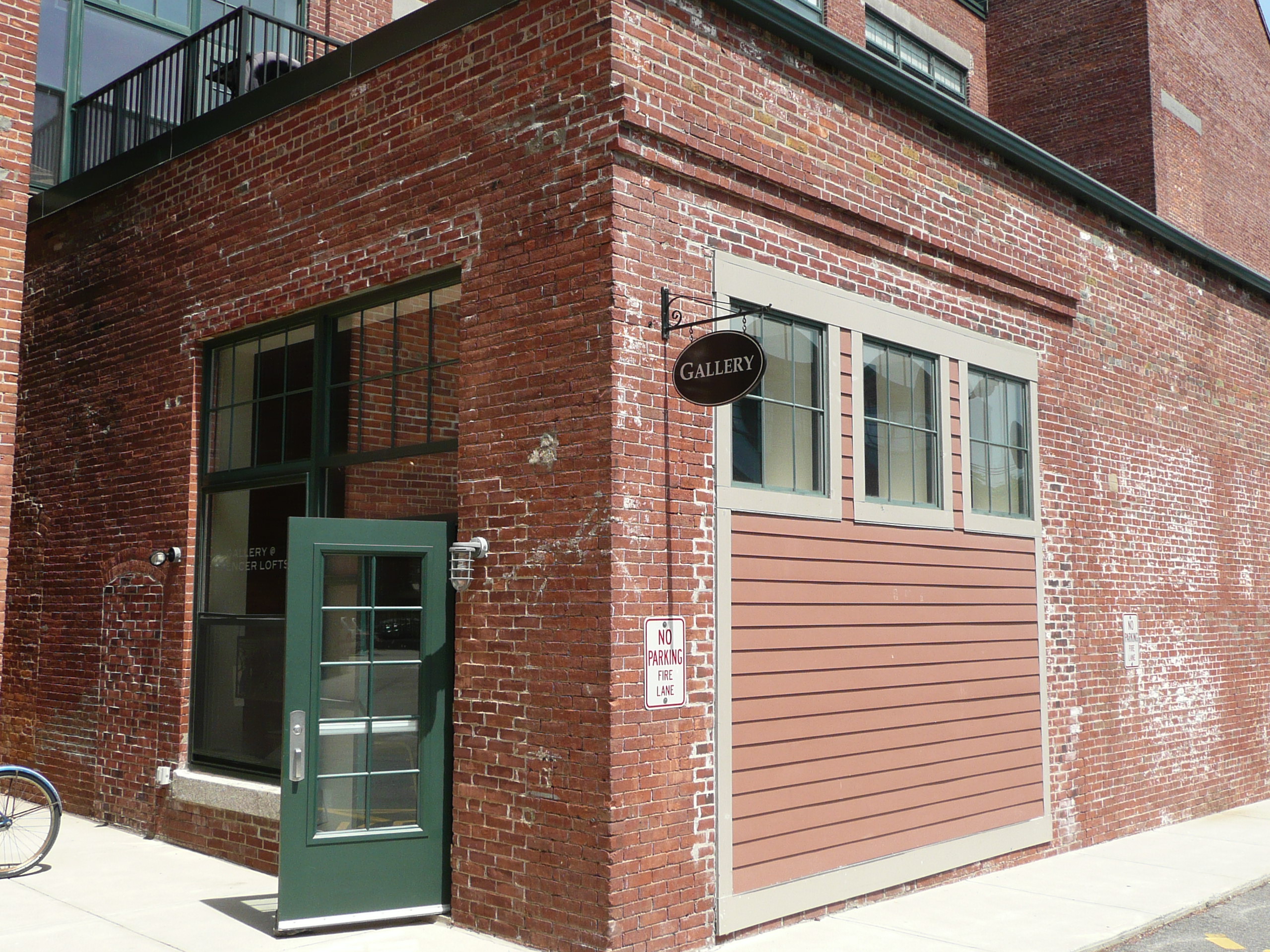 Brick exterior entrance to the Spencer Lofts Gallery at 60 Dudley Street in Chelsea, Massachusetts