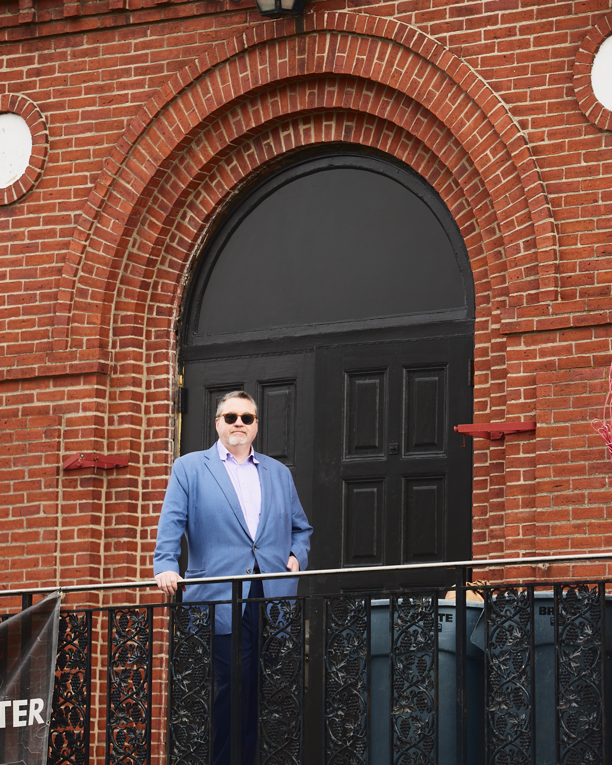 Duplicate upload: man in blue blazer at the arched church entrance at 163 Chestnut Street in Chelsea, Massachusetts